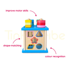 Colourful shapes stacked on the wooden activity cube pegs