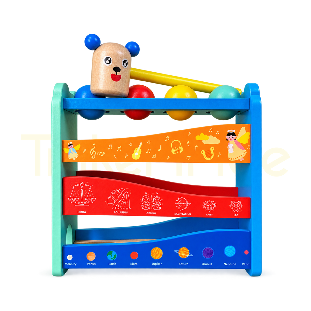 Wooden hammer bench with four colourful balls and sloping ball tracks