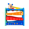 Wooden hammer bench with four colourful balls and sloping ball tracks